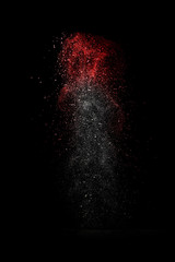 Stop motion of white and red dust explosion isolated on black ba - 73057745