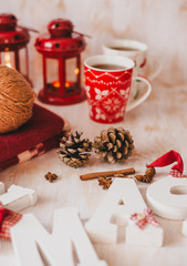 Christmas still life with XMAS letters, tea and present 