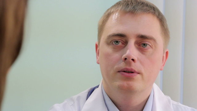 Doctor consults patient