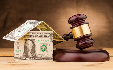 judge gavel with money house closeup