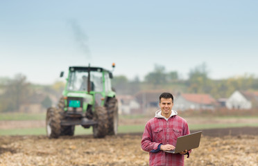 Man with laptop in the field