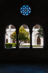 Courtyard of Alcobaca Monastery seen through a window