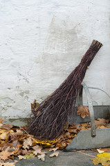 chores in garden with wicker broom