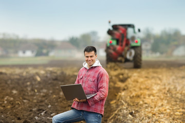 Man with laptop in the field