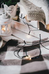 Christmas still life with tea, lights, cones and cookies