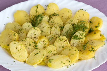 Delicious boiled potatoes with dill and olive