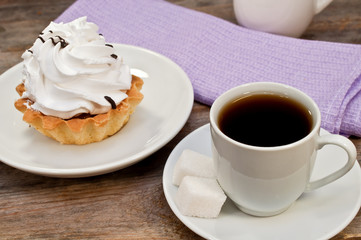 Coffee and cake on wooden table