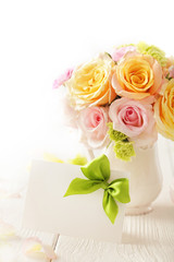 Obraz na płótnie Canvas bouquet of flowers and gift tag