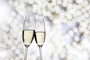 Two glasses with champagne toasting
