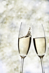Two glasses with champagne toasting