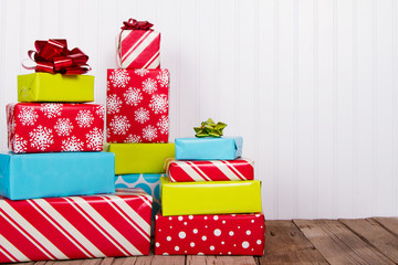 Christmas presents on rustic wood plank