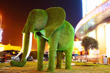 Green grass elephant sculpture