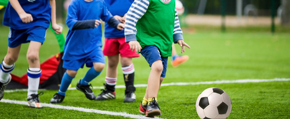 boys kicking football soccer game © matimix