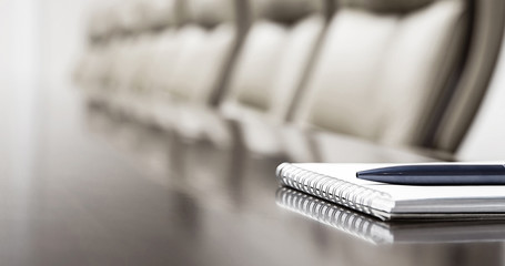 Conference room with agenda on a table. Corporate meeting concept