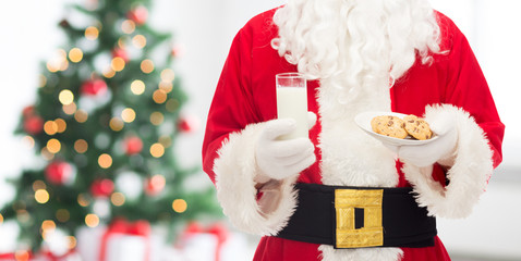 close up of santa claus with milk and cookies