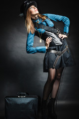 Fototapeta na wymiar beautiful steampunk woman with bag on black.