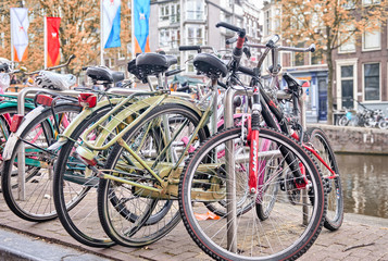 Fototapeta na wymiar Bicycles lining a bridge over the canals of Amsterdam, Netherlan