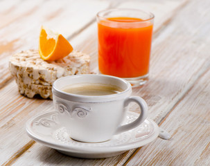 Coffee cup and orange juice