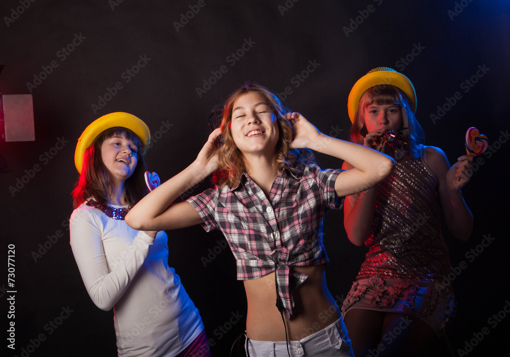 Wall mural teenage girls having fun and dancing at a party