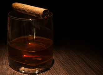 Luxury whiskey glass with cigar