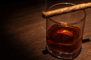 Luxury whiskey glass with cigar