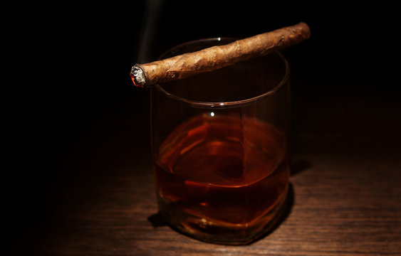 Luxury whiskey glass with cigar