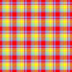 Scottish tartan fabric texture in red and yellow colors.