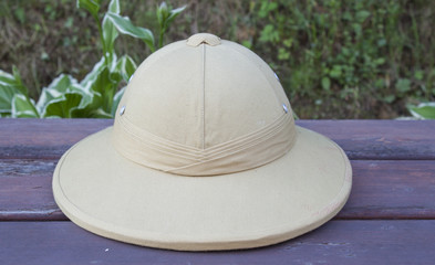 Pith helmet located on the painted bench.