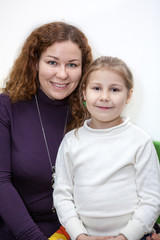 Caucasian mother and preschool daughter portrait