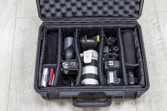 Photo equipments arranged inside of black protector case