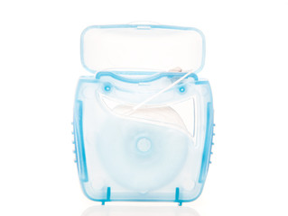 Pack of dental floss. All on white background.