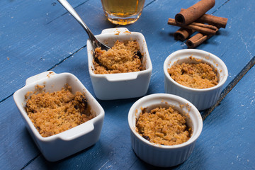 apple crumble on a blue wooden table