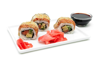 Roll with eel, avocado and salmon on a plate on a white backgrou