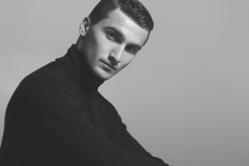 Male beauty concept. Portrait of fashionable young man in black