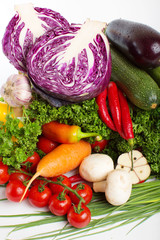 decorative pattern of fresh vegetables on white background