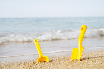Fototapeta na wymiar Children's toys on a sea beach