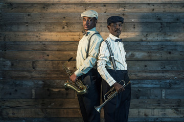 Two african american jazz musicians with trumpet and saxophone s