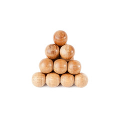 Triangle of wooden balls isolated over white