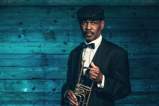 Vintage African American Senior Jazz Musician With Trumpet In Fr