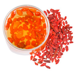 top view of glass goji berries infusion and fruits