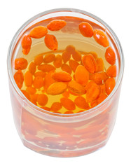 above view of glass with goji berries infusion