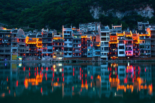 Fototapeta Zhenyuan Ancient Town on Wuyang river at twilight, China
