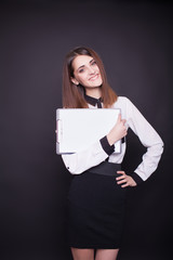 smiling business woman holding blank clipboard