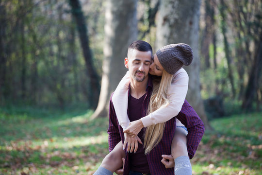 Young couple kissing in autumn park