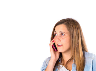 Girl talking to mobile over white background