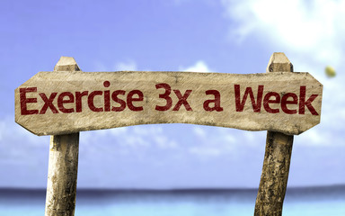 Exercise 3x a Week sign with a beach on background