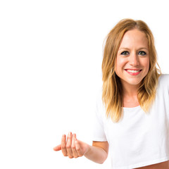 Happy blonde girl over white background