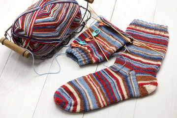 knitting winter warm socks, yarn ball and knitting needles