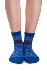 Perfect female legs in blue knitted socks