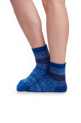 Perfect female legs in blue knitted socks